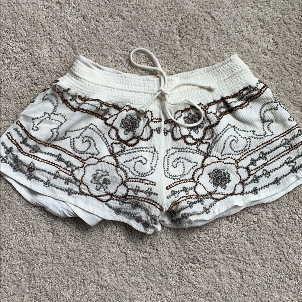 Ivory shorts with silver and copper beading